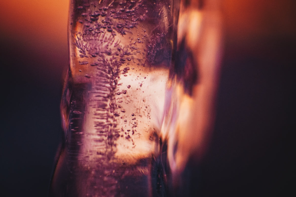 a close up of a glass filled with water
